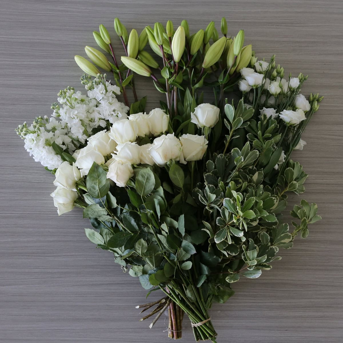 bulk white flower bundle open pack roses lilies stock lisianthus pittosporum greenery